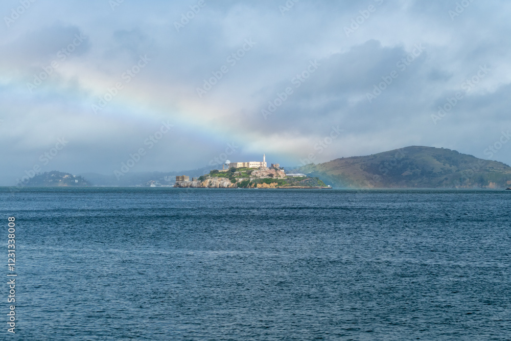 Prison of Alcatraz in sunlight with a rainbow on a party sunny day, San Francisco California Prison of Alcatraz in sunlight with a rainbow on a party sunny day, San Francisco California