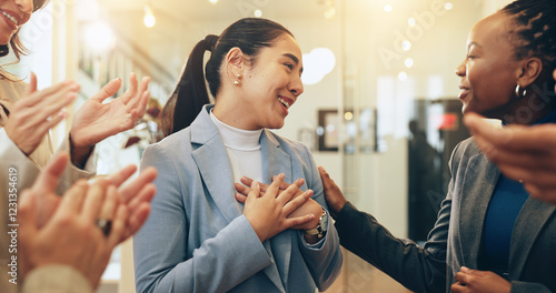 Business people, woman and applause in office for support, positive reinforcement and colleague promotion. Employee, winner and happy in lobby for career growth, successful campaign or achievement