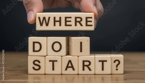 Wooden blocks spelling out the question 'Where do I start?'  A hand holds the 'WHERE' block above the rest.