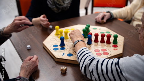 Four woman in a nursing home playing a board game