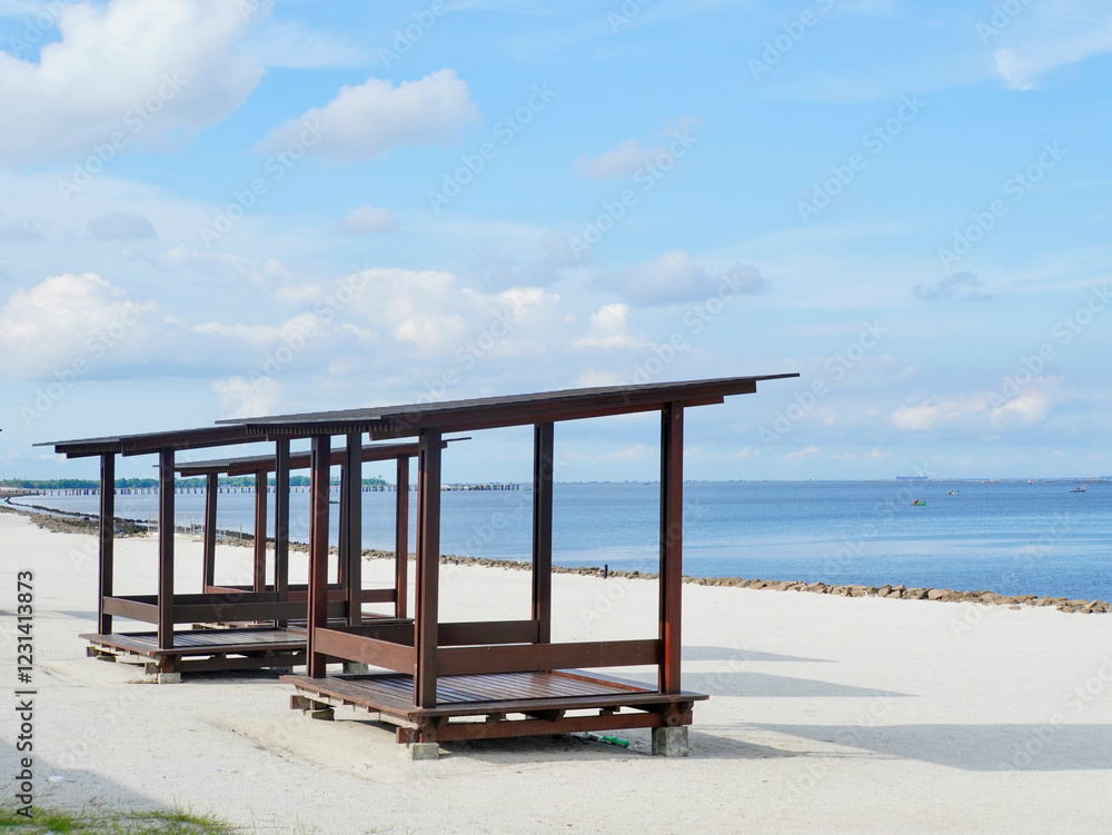 Fototapeta premium The relaxation hut at the white sand beach or pantai pasir putih at PIK 2 in Jakarta, Indonesia