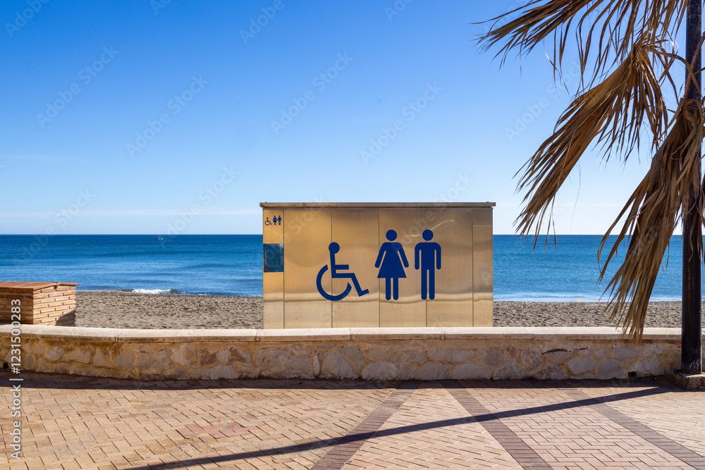 Photo of the beautiful beach front in the town of Fuengirola in Spains Costa Del Sol showing public toilets on the beach know locally as Playa Para Perros on a sunny day