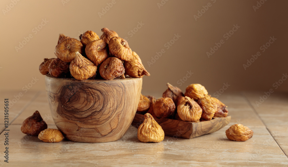 Organic dried figs on a beige background. Organic dried figs on a beige background.