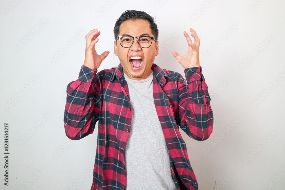 Fototapeta premium Shocked and alarmed asian man reacting to terrible news, standing in panic over white background and shaking hands indecisive, dont know what do, feeling useless, white background