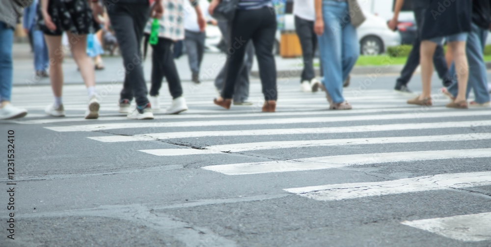 People crossing the zebra on the road. People crossing the zebra on the road.