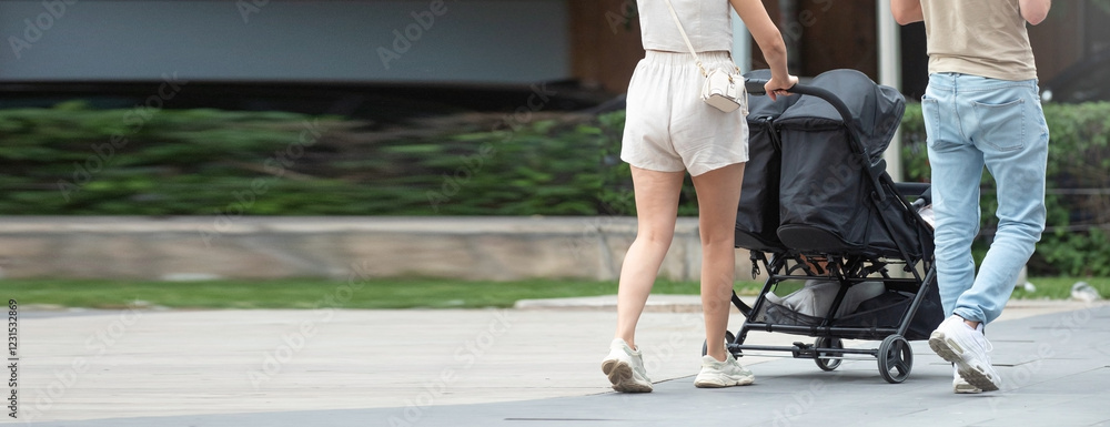 Couple walking in city baby in stroller. Couple walking in city baby in stroller.