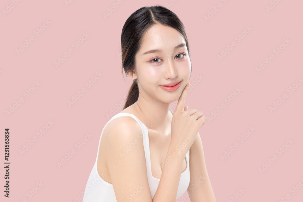 A vibrant and healthy young woman with radiant skin smiles confidently, against a soft pink backdrop. A vibrant and healthy young woman with radiant skin smiles confidently, against a soft pink backdrop.