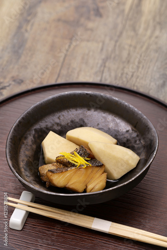 Ebi-imo ( shrimp shaped taro ) simmered with dried codfish. Japanese traditional cuisine (local dish from Kyoto). photo