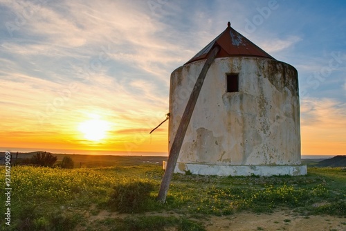 Vejer de la Frontera, ruin of an old wind mill within sunset. Cadiz province, Andalusia, Spain