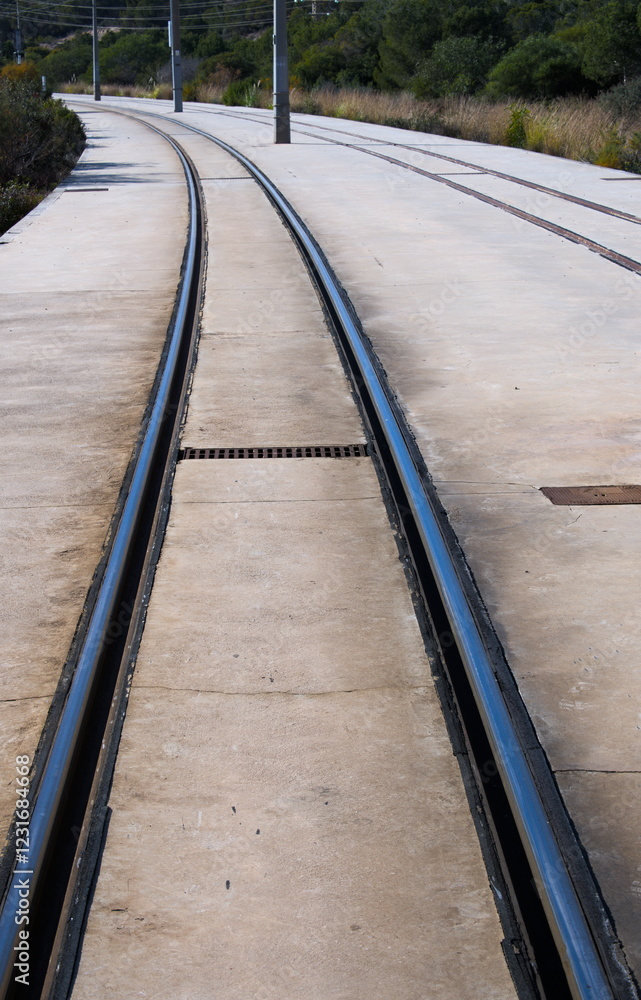Railway track in a concrete foundation of local railway lines Railway track in a concrete foundation of local railway lines