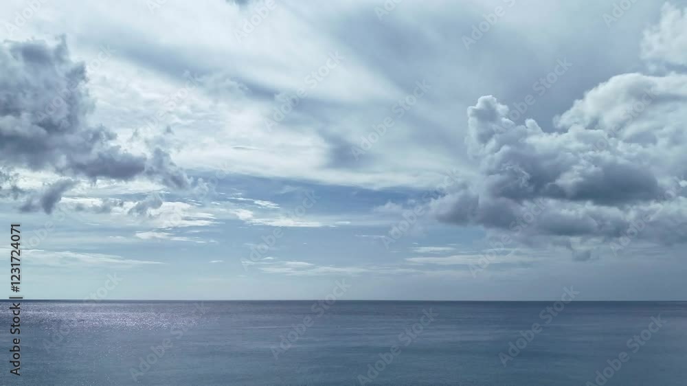 Fast-moving clouds sweeping across an overcast ocean horizon in the Philippines. This real-time timelapse reveals moody skies and highlights nature’s ever-changing climate Fast-moving clouds sweeping across an overcast ocean horizon in the Philippines. This real-time timelapse reveals moody skies and highlights nature’s ever-changing climate