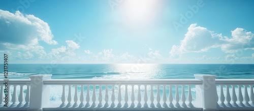 Fototapeta Naklejka Na Ścianę i Meble -  Balcony overlooking serene ocean waves under a bright blue sky with fluffy clouds creating a tranquil travel and nature ambiance