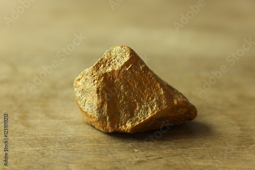 gold rock on wood background