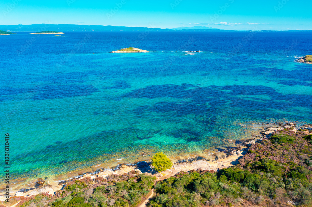 Panoramic view of seascape with beautiful bay on a sunny day. View from above. Vourvourou, Greece, Europe