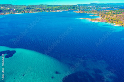 Obraz na płótnie Panoramic view of seascape with beautiful bay on a sunny day. View from above. Vourvourou, Greece, Europe w salonie