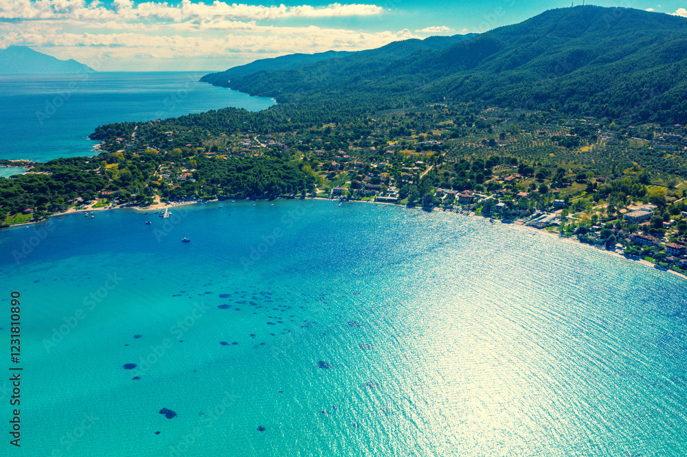 Panoramic view of seascape with beautiful bay on a sunny day. View from above. Vourvourou, Greece, Europe