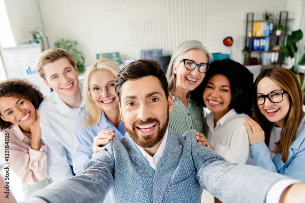 Smiling professional team taking a selfie showcasing workplace collaboration and diversity Smiling professional team taking a selfie showcasing workplace collaboration and diversity