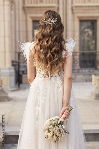 Wallpaper Mural Modern young bride in wedding dress from behind with glam wavy hairstyle with crystal haircomb outdoors. No face woman with blond curly long hair. Torontodigital.ca