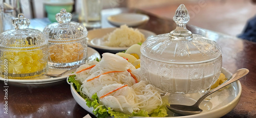 Obraz na płótnie Rice Vermicelli with Coconut Milk traditional Thai noodle serving in the crystal craving glassware. w salonie