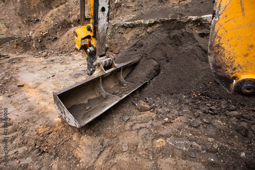 excavator on a construction site. Excavator digging earth for earthworks and construction. Heavy equipment for earthworks and construction excavator on a construction site. Excavator digging earth for earthworks and construction. Heavy equipment for earthworks and construction