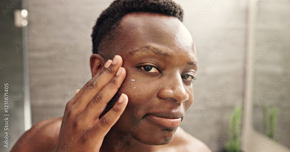 Eye cream, skincare and face with black man in bathroom for beauty, morning routine and cosmetics. Treatment, hotel resort and cleaning with person at home for grooming, spa glow and self care Eye cream, skincare and face with black man in bathroom for beauty, morning routine and cosmetics. Treatment, hotel resort and cleaning with person at home for grooming, spa glow and self care