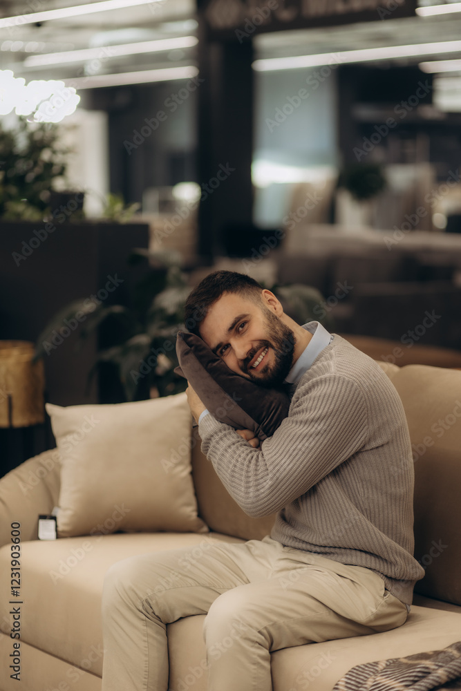 Obraz premium A man chooses and buys a pillow and a sofa