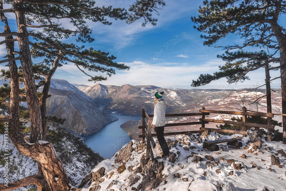 Man Tourist Enjoying Winter Landscape from Viewpoint
