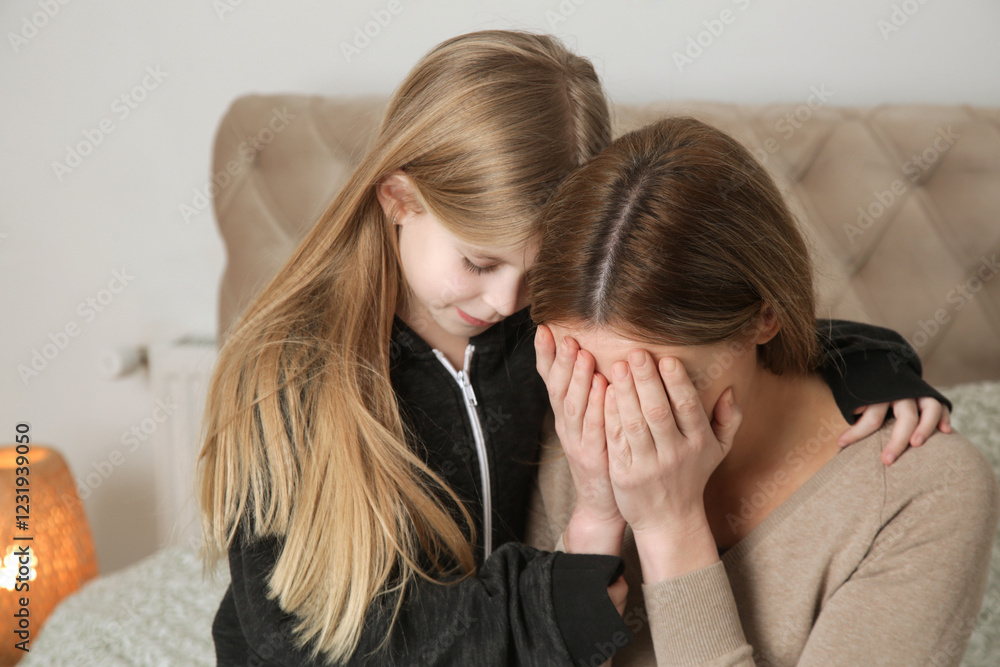 Loving worried daughter consoling her sad depressed mother Loving worried daughter consoling her sad depressed mother