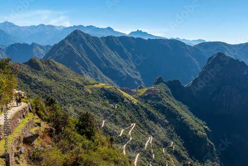People walking the Inca Trail from the Sun Gate to Machu Picchu, Cusco, Peru.