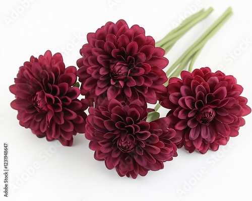 Bouquet of four burgundy artificial dahlias. photo