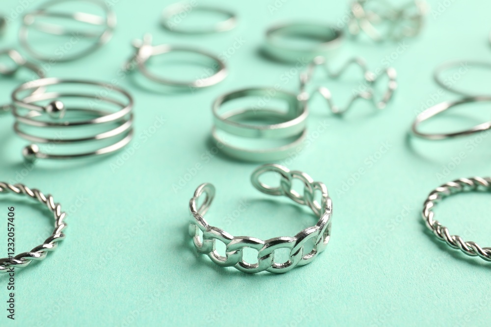 Different stylish accessories on turquoise background, closeup Different stylish accessories on turquoise background, closeup