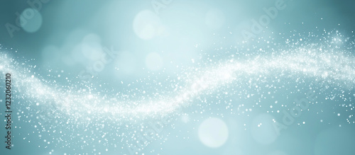 Soft glowing and shimmering abstract background with a wave of sparkling white particles against a light blue backdrop. 