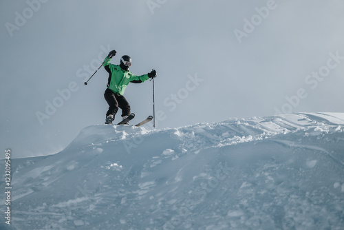 Wallpaper Mural Person in green jacket skiing downhill on a slope covered with fresh snow and ice. Torontodigital.ca