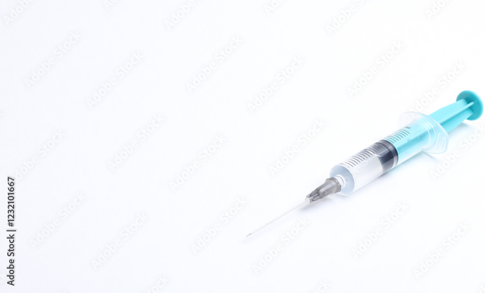 Medical syringe on a white background. A syringe for injection. The concept of health and beauty Medical syringe on a white background. A syringe for injection. The concept of health and beauty