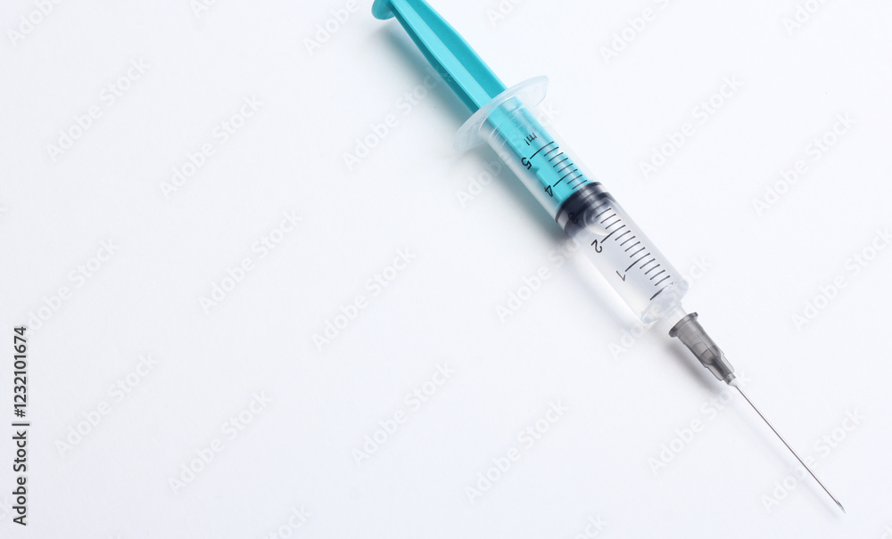 Medical syringe on a white background. A syringe for injection. The concept of health and beauty Medical syringe on a white background. A syringe for injection. The concept of health and beauty