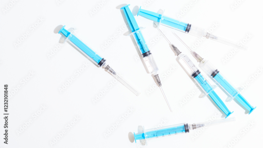Disposable plastic syringe prepared for injection and vaccination in the hospital. The concept of medicine and health Disposable plastic syringe prepared for injection and vaccination in the hospital. The concept of medicine and health