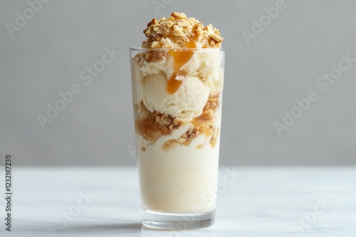 Wallpaper Mural Creamy vanilla ice cream delight topped with caramel and crunchy nuts in a tall glass masterpiece. Generative AI Torontodigital.ca