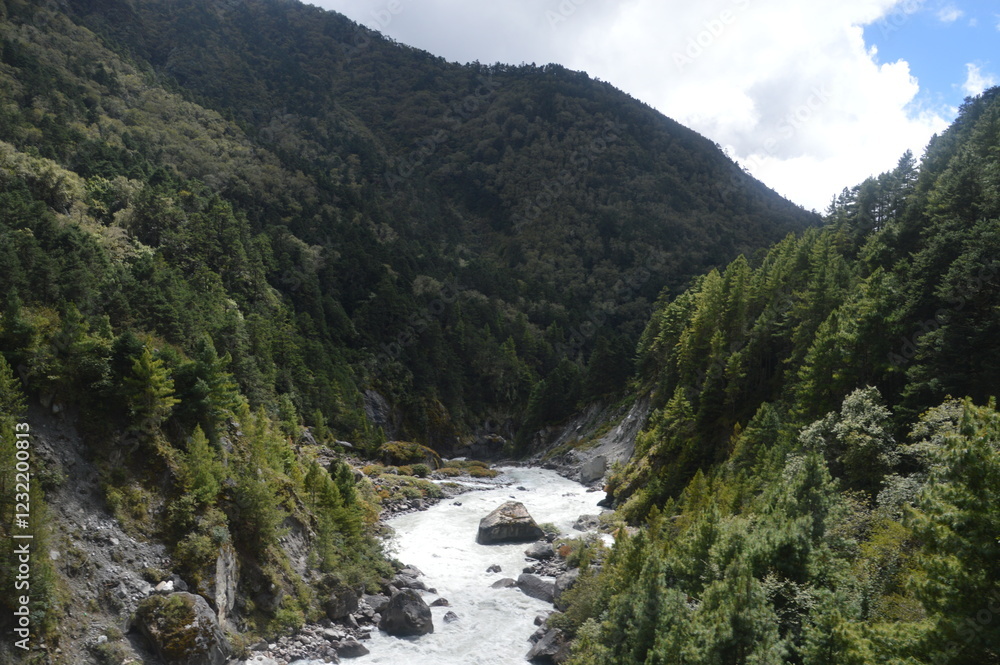 Hiking in the stunning Khumbu Valley surrounded by glaciars and snowy peaks in the Himalayan Everest Base Camp Trek Hiking in the stunning Khumbu Valley surrounded by glaciars and snowy peaks in the Himalayan Everest Base Camp Trek