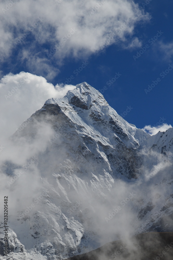 Mount Everest and the Khumbu Icefall Glacier as seen from the valley on the Everest Base Camp Trek, Nepal Mount Everest and the Khumbu Icefall Glacier as seen from the valley on the Everest Base Camp Trek, Nepal