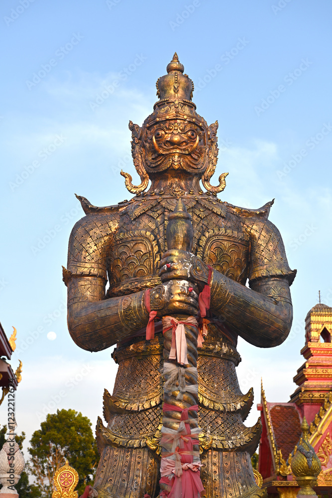Fototapeta premium A traditional Thai giant in front of the temple in Thailand