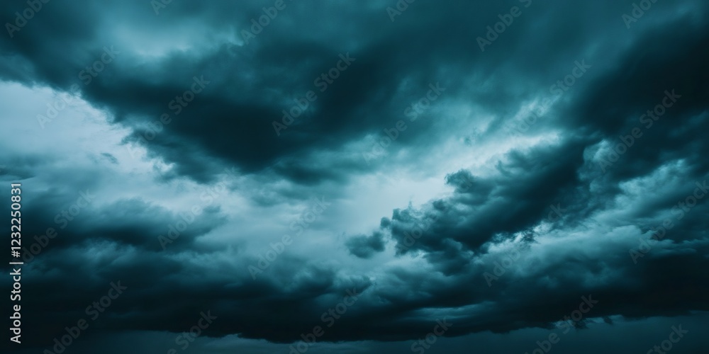 Obraz premium Dramatic teal cumulonimbus clouds looming menacingly, signaling imminent thunderstorm with ominous, brooding sky landscape