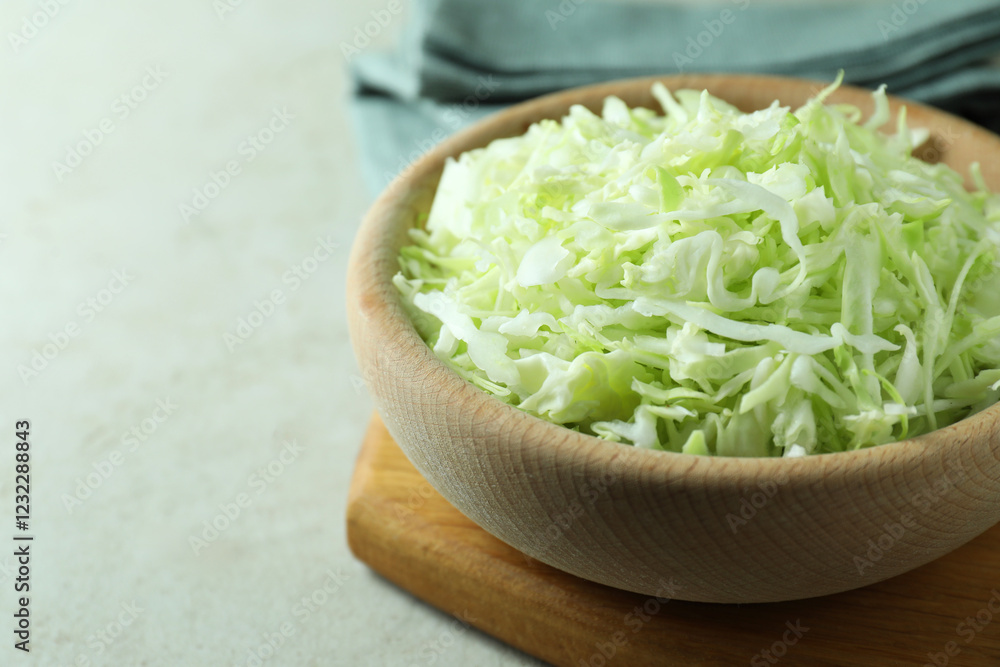 Fresh shredded cabbage on light table, closeup. Space for text Fresh shredded cabbage on light table, closeup. Space for text
