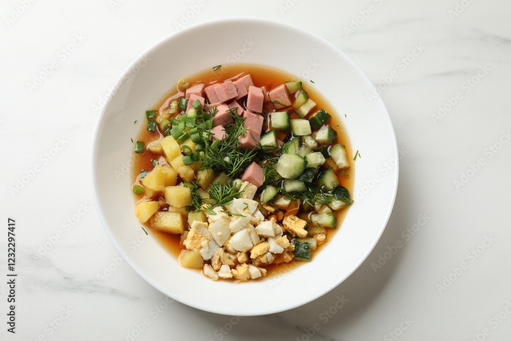 Delicious okroshka soup with kvass on white table, top view Delicious okroshka soup with kvass on white table, top view