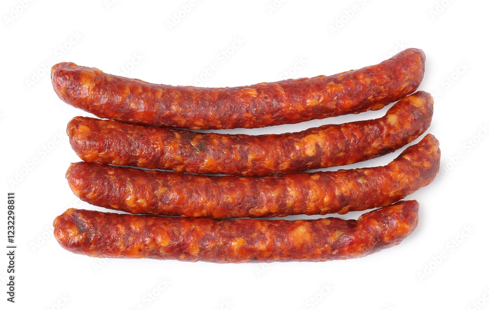 Many thin dry cured sausages isolated on white, top view Many thin dry cured sausages isolated on white, top view