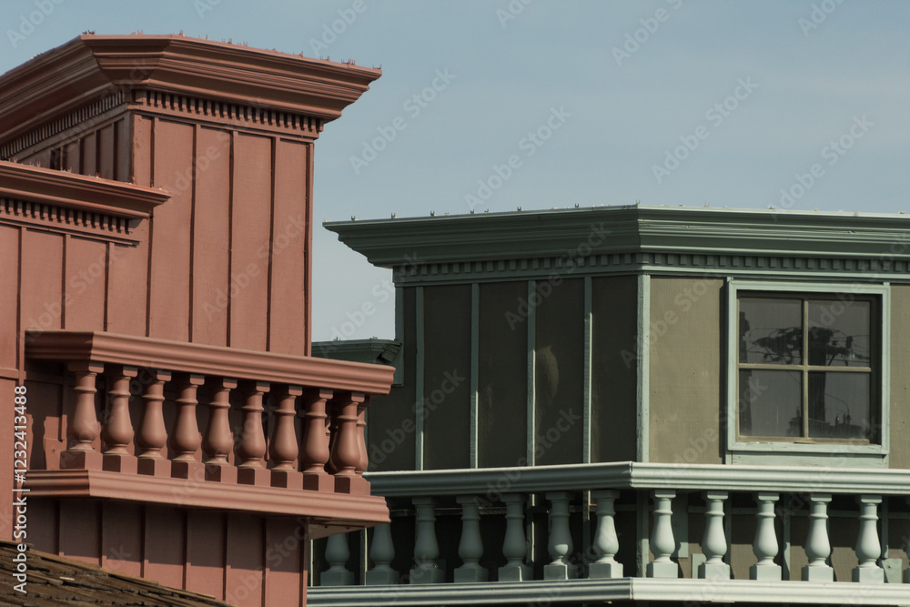 Obraz premium Exterior details of red-brown and green buildings with white balconies in Old Town, Scottsdale