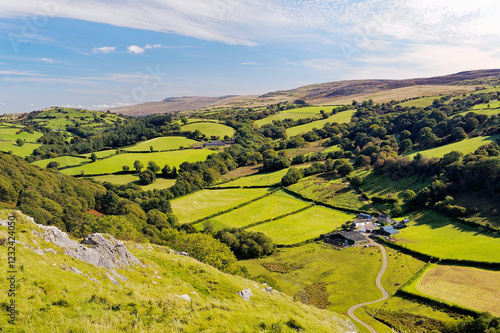 Looking east from Carreg Cennen castle up hill farm farmland toward the Black Mountain, Wales, UK. Brecon Beacons National Park