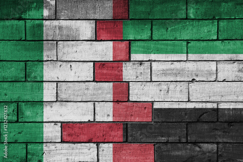 Fototapeta Naklejka Na Ścianę i Meble -  colourful painted big flag of italy and flag of united arab emirates on a massive old brick wall background. concept