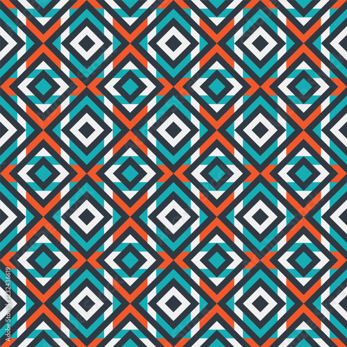 A seamless pattern featuring a repeating geometric design of interlocking squares in shades of blue, orange, black, and white