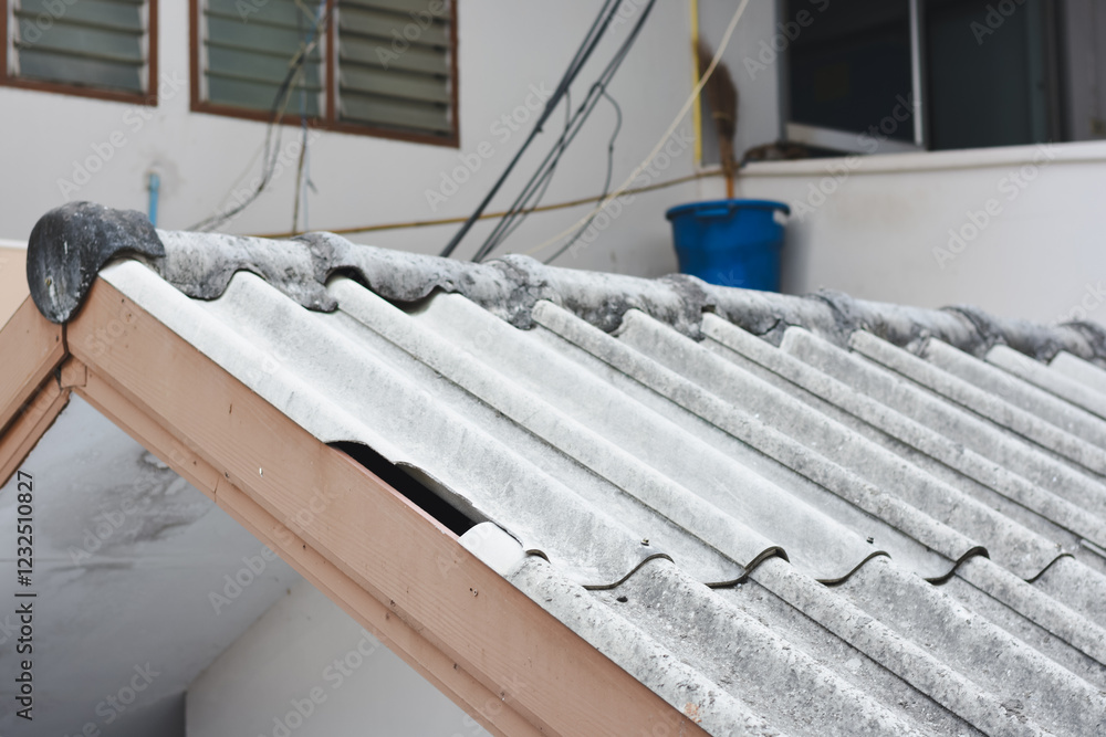 Obraz premium Close-up of a damaged tiled roof.