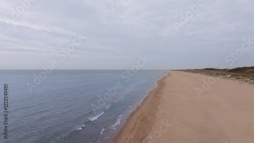drone footage of a sandy beach shoreline in County Wexford, Ireland
